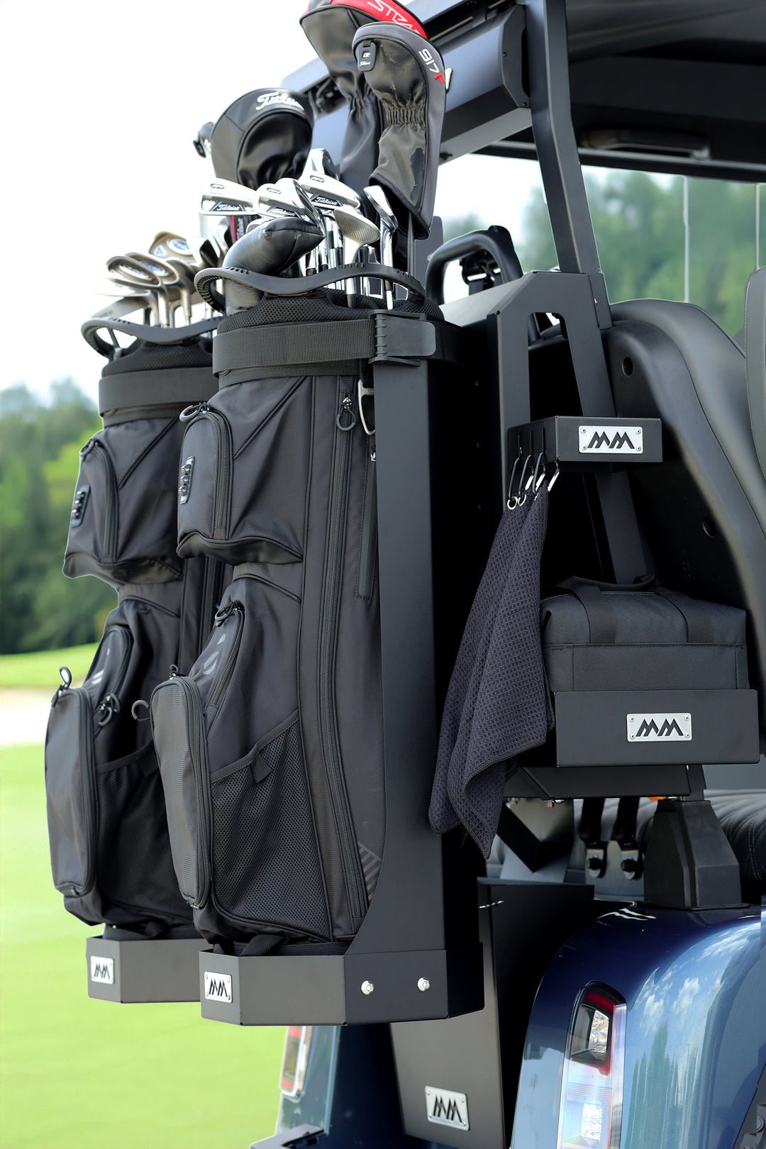 SUMMIT LINK golf setup with two bag caddies mounted on HUB on the back of a golf cart